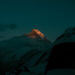 Mountain Landscapes - A stunning nighttime view of a sunlit mountain p #11595461