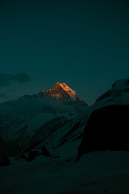 Mountain Landscapes - A stunning nighttime view of a sunlit mountain p #11595461