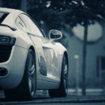 Luxury Cars - A luxury white sports car parked on a street in #13148546
