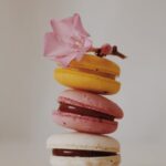 Food Aesthetics - Stacked colorful macarons with a pink flower on #13555320