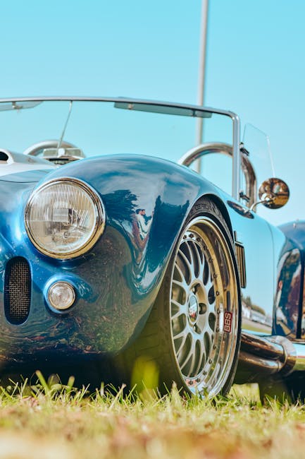 Luxury Cars - Close-up of a vintage blue convertible car with #14038353