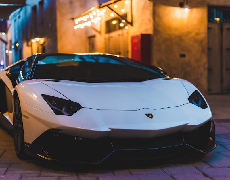 Luxury Cars - White sports car with sleek design parked in an #14196938