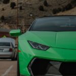 Luxury Cars - Vibrant green Lamborghini Huracan parked in a sc #16124146