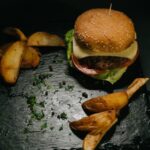 Food Aesthetics - Close-up of a delectable cheeseburger with crisp #16148034