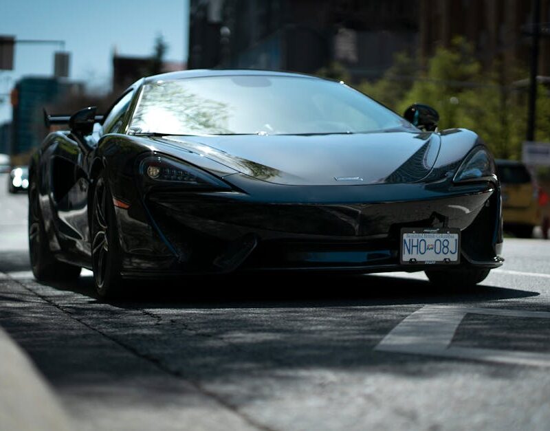 Luxury Cars - Sleek black sports car positioned prominently on #16595082