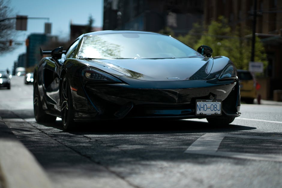 Luxury Cars - Sleek black sports car positioned prominently on #16595082