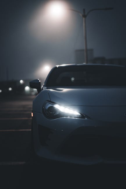 Luxury Cars - A sleek sports car with illuminated headlights i #17245109