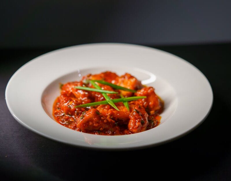 Food Aesthetics - Spicy Indian paneer tikka served in a rich tomat #28674541