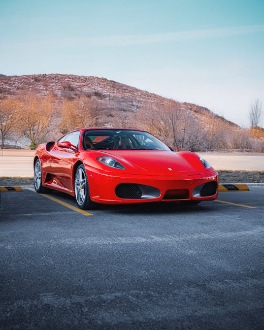 Luxury Cars - A stunning red Ferrari car parked against a scen #30599907