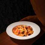 Food Aesthetics - A vibrant Italian pasta dish garnished with herb #31261502
