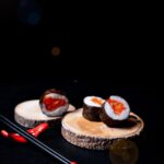 Food Aesthetics - Artistic sushi presentation with salmon rolls on #31286783