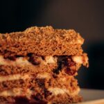 Food Aesthetics - A tempting slice of layered cake with cream and #34159031