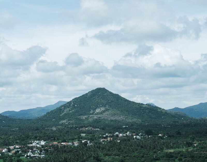 Mountain Landscapes - Lush green hills under a cloudy sky in Bengaluru #34271583