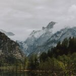 Mountain Landscapes - Low angle of rough mounts covered with mist near #4390123