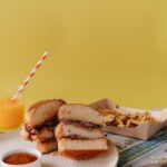 Food Aesthetics - A tasty chicken burger with french fries and ora #7497294