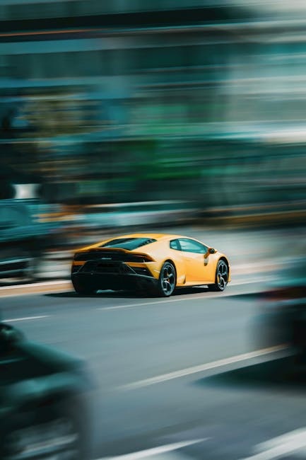 Luxury Cars - A vibrant yellow sports car captures attention a #8954274