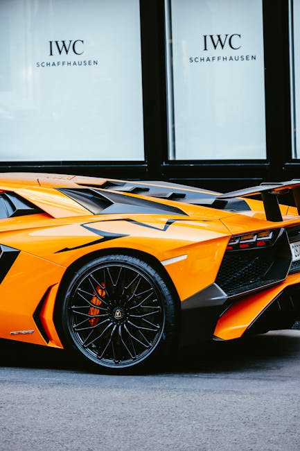 Luxury Cars - Close-up of an orange Lamborghini Aventador park #9322194